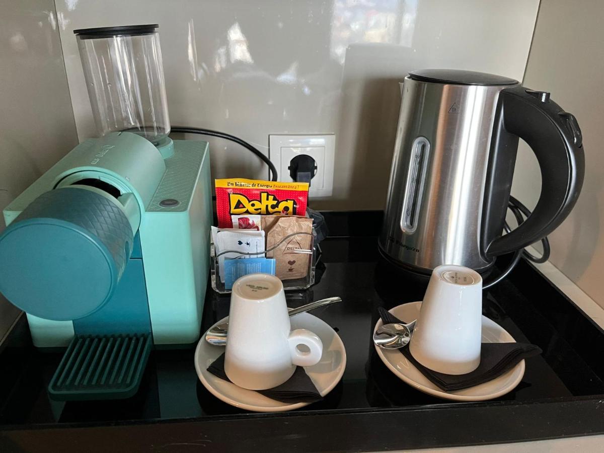 メリア ブラガ ホテル ＆ スパ エクステリア 写真 A Nespresso coffee machine in a hotel room